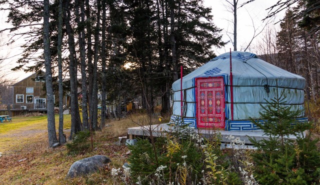 Small red yurt at Cabot Shores Wilderness Resort