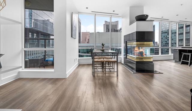 Spacious, modern TOP FLOOR condo downtown w/ balcony + views!