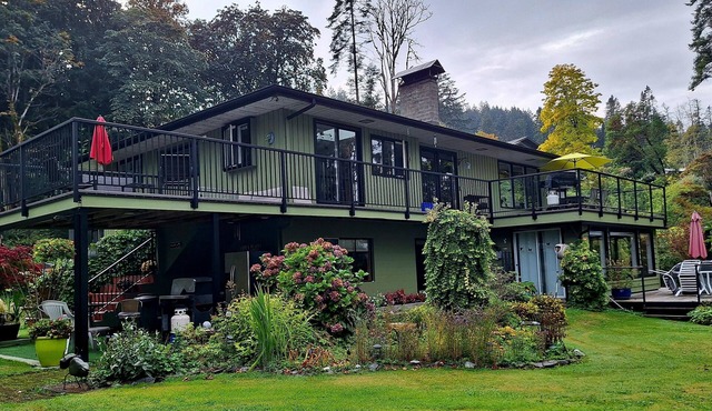 Spectacular beach front property with stunning view of coastal mountains.