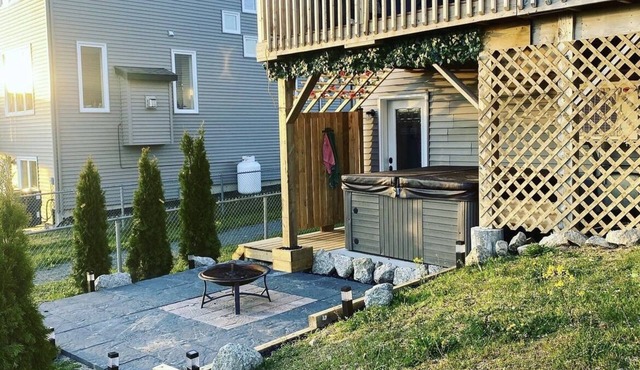 The Governor's Suite - An executive oasis featuring a hot tub, fire pit and BBQ!
