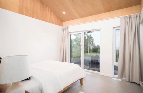 Inverness House | Modern 4 Bedroom, 4.5 bath home near Cabot Links with ocean views and sunsets.